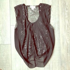Black top with sequin underlining.